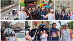 La Fiamma olimpica illumina Fermo, la fiaccola batte anche la pioggia